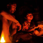 Father and son by the fire